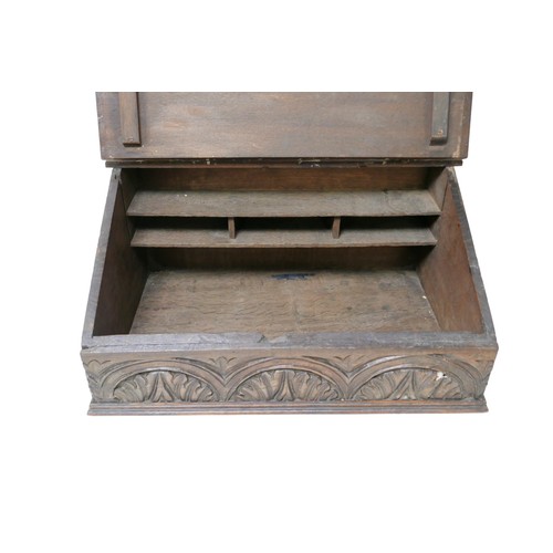 148 - An 18th century oak Bible box, with carved front panel and interior cubby holes, 57.5 by 37.5 by 27c... 