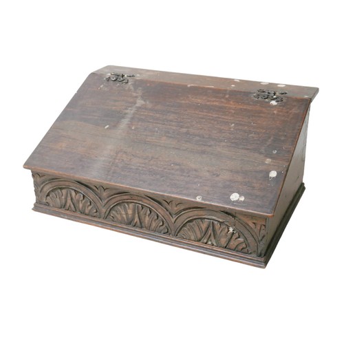 148 - An 18th century oak Bible box, with carved front panel and interior cubby holes, 57.5 by 37.5 by 27c... 