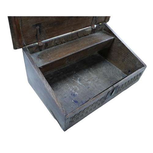 138 - A 19th century oak Bible box, with a blind carved frieze panel to its front, 65 by 39 by 26cm high.