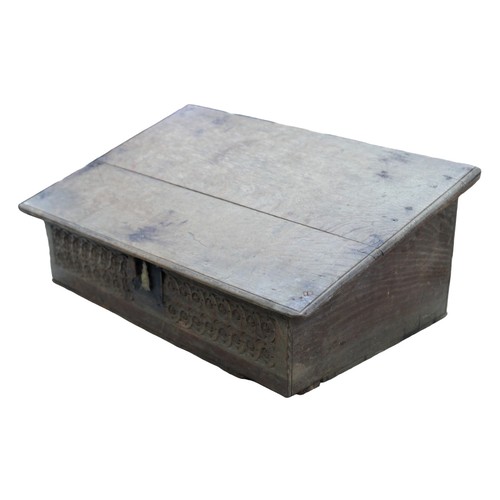 138 - A 19th century oak Bible box, with a blind carved frieze panel to its front, 65 by 39 by 26cm high.