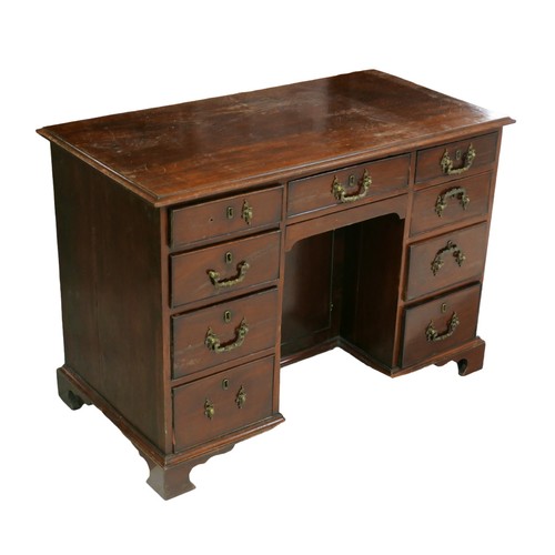 257 - A Victorian mahogany knee-hole desk, with single middle drawer flanked by two banks of four drawers,... 