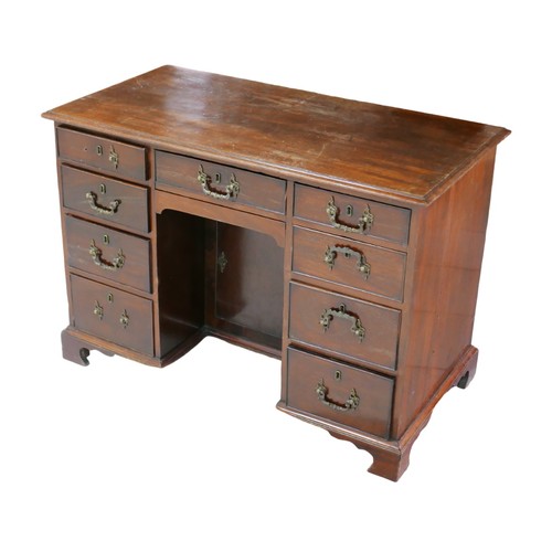 257 - A Victorian mahogany knee-hole desk, with single middle drawer flanked by two banks of four drawers,... 