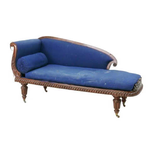 267 - A Victorian chaise longue, with mahogany frame and blue upholstery, raised upon brass castors, a/f, ... 