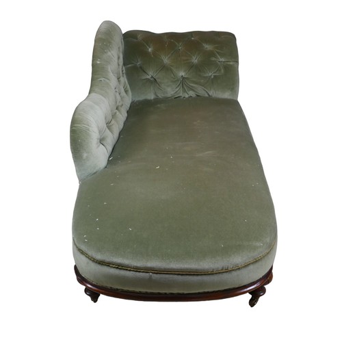 270 - An Edwardian chaise longue, with walnut frame and button backed green upholstery, raised upon castor... 