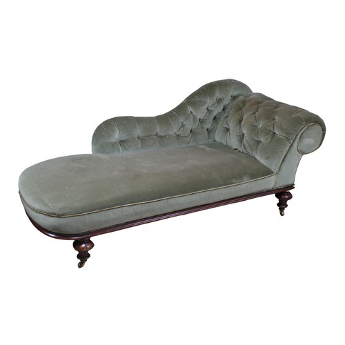 270 - An Edwardian chaise longue, with walnut frame and button backed green upholstery, raised upon castor... 