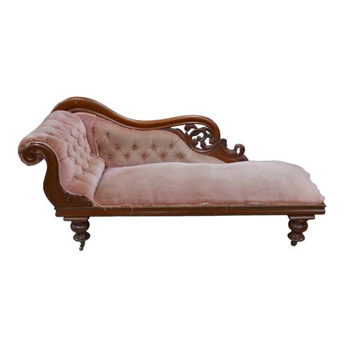 264 - An Edwardian chaise longue, with pale pink button back upholstery and mahogany frame, a/f, 182 by 58... 