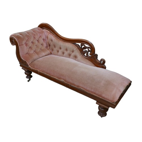 264 - An Edwardian chaise longue, with pale pink button back upholstery and mahogany frame, a/f, 182 by 58... 