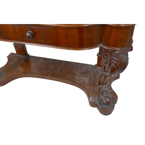 265 - A Victorian mahogany dressing table, its hinged oval mirror with shaped supports, two banks of six s... 