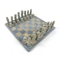 An African soapstone chess set, board 36 by 36cm.
