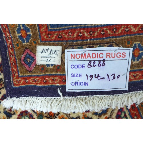 263 - A Mood rug, on cream ground with two narrow, beige borders flanking a larger deep blue border, 198 b... 