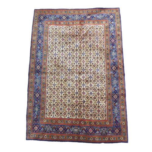 263 - A Mood rug, on cream ground with two narrow, beige borders flanking a larger deep blue border, 198 b... 