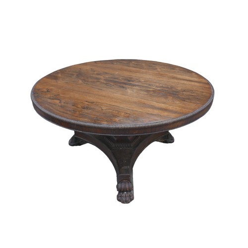 279 - A Regency rosewood breakfast table, circular tilt top with reeded edge, raised on shaped base with c... 