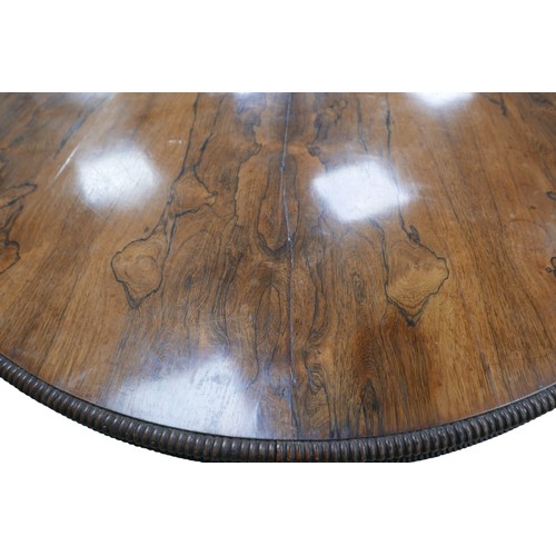 279 - A Regency rosewood breakfast table, circular tilt top with reeded edge, raised on shaped base with c... 