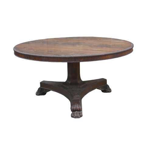 279 - A Regency rosewood breakfast table, circular tilt top with reeded edge, raised on shaped base with c... 