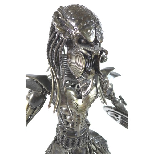 130 - A handmade scratch metal sculpture of 'The Predator', made entirely of motorcycle parts, 65cm high.