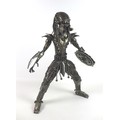 A handmade scratch metal sculpture of 'The Predator', made entirely of motorcycle parts, 65cm high.