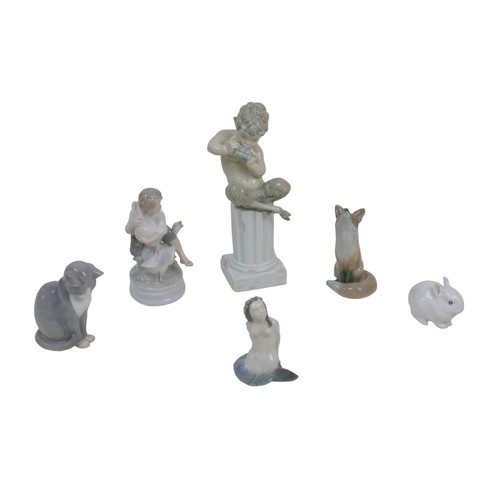 32 - Four Royal Copenhagen figurines, comprising a mermaid (3321), 11cm high, a fox (1475), 14cm high, a ... 