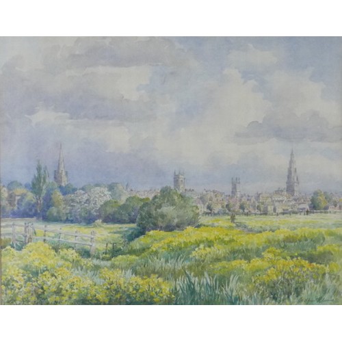 Wilfrid Rene Wood (British, 1888-1976): a view of Stamford from Stamford Meadows, watercolour, including the figure of Joseph Woods a Stamford shopkeeper, signed and dated '58', 30.5 by 38.5cm, mounted, glazed and framed, 53 by 61cm.