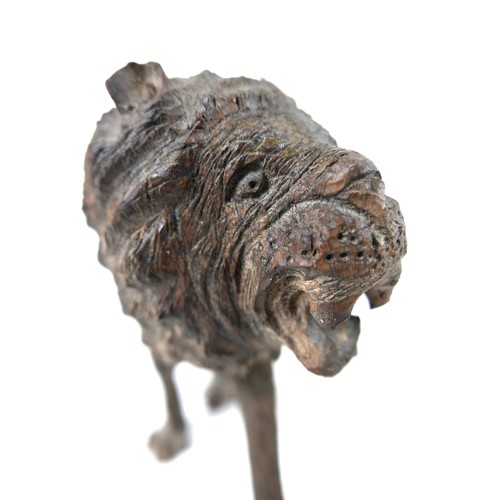 137 - A 19th century carved wooden sculpture of a lion, 24 by 7.5 by 16.5cm high.