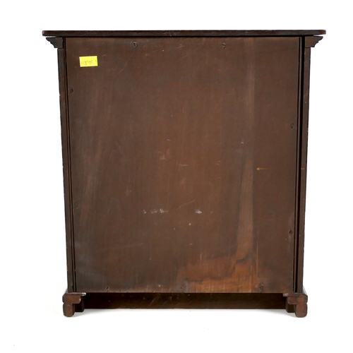 142 - A miniature Edwardian chest of drawers, brass handles, 32 by 18 by 34.5cm high.