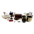 A mixed group of EPNS and metal wares, including a swing handled basket, goblet, salt 'scuttle', pai... 