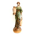 A large Austrian Amphora Pottery figure, modelled as a female water carrier, circa 1880's, decorated... 