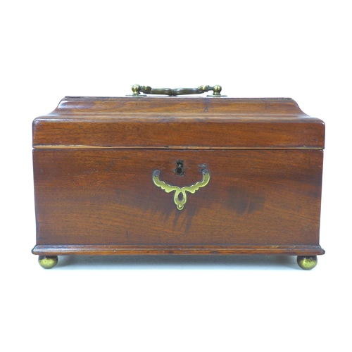 139 - A Georgian mahogany tea caddy, with brass fittings and three compartments to its interior, raised up... 