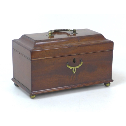 139 - A Georgian mahogany tea caddy, with brass fittings and three compartments to its interior, raised up... 