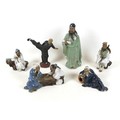 A group of Chinese 'mud man' figurines, in various poses, largest 28cm high. (6)