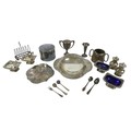 A group of silver plated wares, including cruet sets with blue glass liners, a twin handled pot and ... 