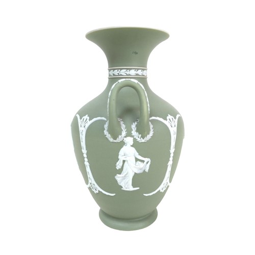 62 - A Wedgwood Jasperware dip green vase, of baluster form with twin handles, decorated with female figu... 