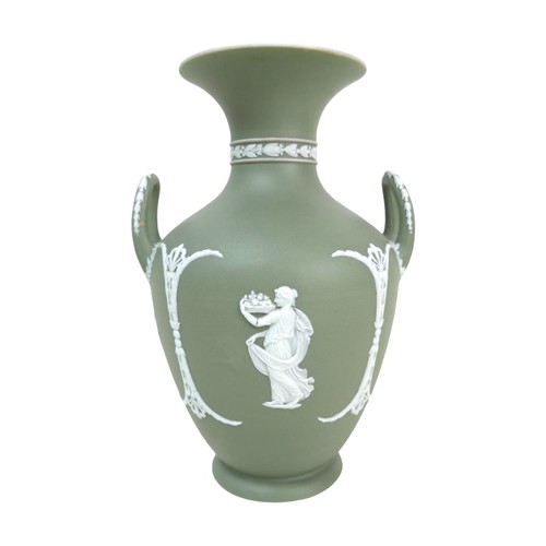 62 - A Wedgwood Jasperware dip green vase, of baluster form with twin handles, decorated with female figu... 