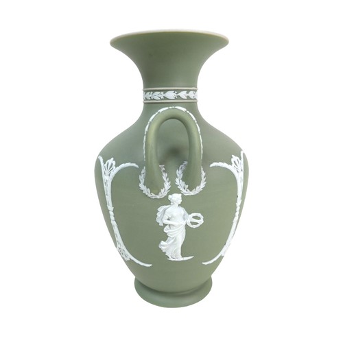 62 - A Wedgwood Jasperware dip green vase, of baluster form with twin handles, decorated with female figu... 