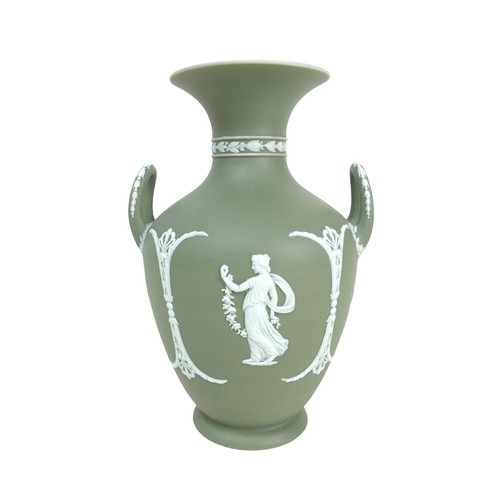 62 - A Wedgwood Jasperware dip green vase, of baluster form with twin handles, decorated with female figu... 