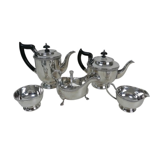 25 - A collection of silver plate, including a pair of Mappin and Webb short candlesticks, 11.5cm high, a... 