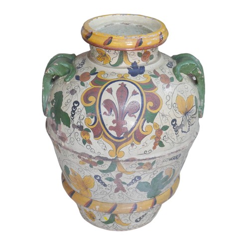 63 - A large mediterranean hand painted terracotta vase, with twin handles, decorated with a fleur de lys... 