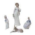 Four Lladro figurines, comprising a 'Dainty Lady', 35cm high,  'Evita' girl with umbrella, 18cm high... 
