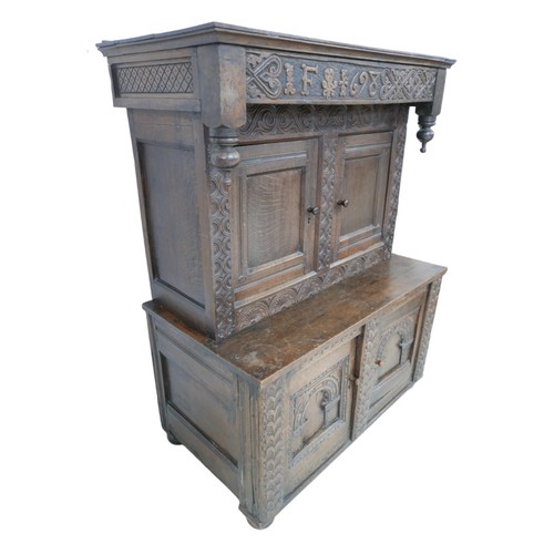 348 - A Jacobean style oak cabinet made from older timber, probably 19th century, decorated with carved in... 