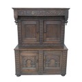 A Jacobean style oak cabinet made from older timber, probably 19th century, decorated with carved in... 
