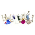 A collection of figurines, including three early Lladro bedtime figures, 'Girl in nightdress with ca... 