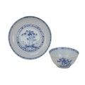 A Chinese porcelain Nanking cargo blue and white tea bowl and saucer, 18th century, decorated with b... 