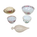 A group of 18th century and later English creamware, including a Chelsea tea bowl, with gilt rim and... 