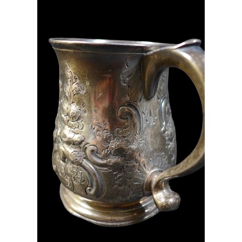 32 - A George II silver tankard, with repousse floral decoration, rubbed hallmarks possibly London 1738, ... 
