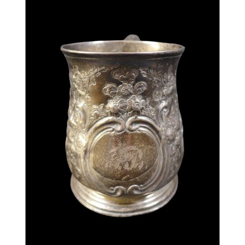 32 - A George II silver tankard, with repousse floral decoration, rubbed hallmarks possibly London 1738, ... 