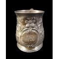 A George II silver tankard, with repousse floral decoration, rubbed hallmarks possibly London 1738, ... 
