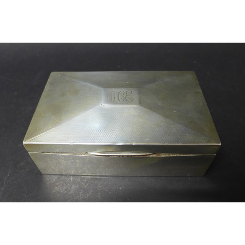 15 - A collection of silver, comprising a cigarette box, with cedar lining, bearing monogram 'WCE' to its... 