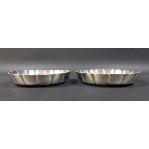59 - A pair of George V Britannia silver strawberry dishes, of circular form with scalloped rims, William... 