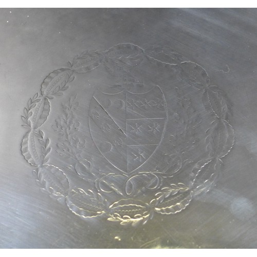 1 - A George III silver salver, with armorial engraving to its centre, beaded rim and raised upon three ... 