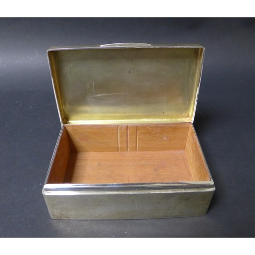 25 - Two George V silver cigarette boxes, the largest with the Oundle school insignia and motto to its li... 