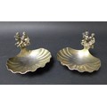 A pair of ERII royal commemorative silver gilt salt dishes, with ornate handles incorporating cherub... 